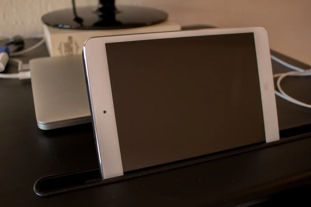 A picture showing an iPad mini inserted in the slot for tablets